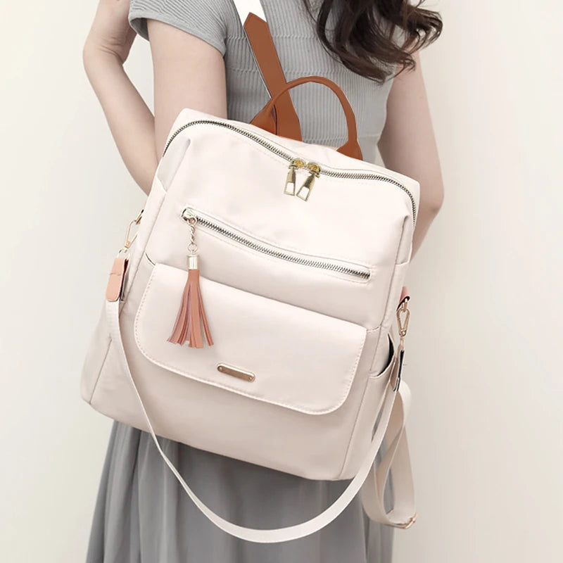 Chic Stylish Multi-Color Backpack with Tassel Detail, Adjustable Strap, Lightweight for Daily Use, Casual Functional Fashionable Bag