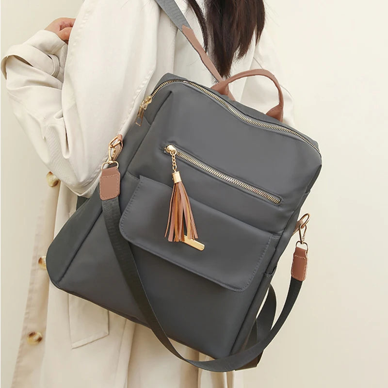 Chic Stylish Multi-Color Backpack with Tassel Detail, Adjustable Strap, Lightweight for Daily Use, Casual Functional Fashionable Bag